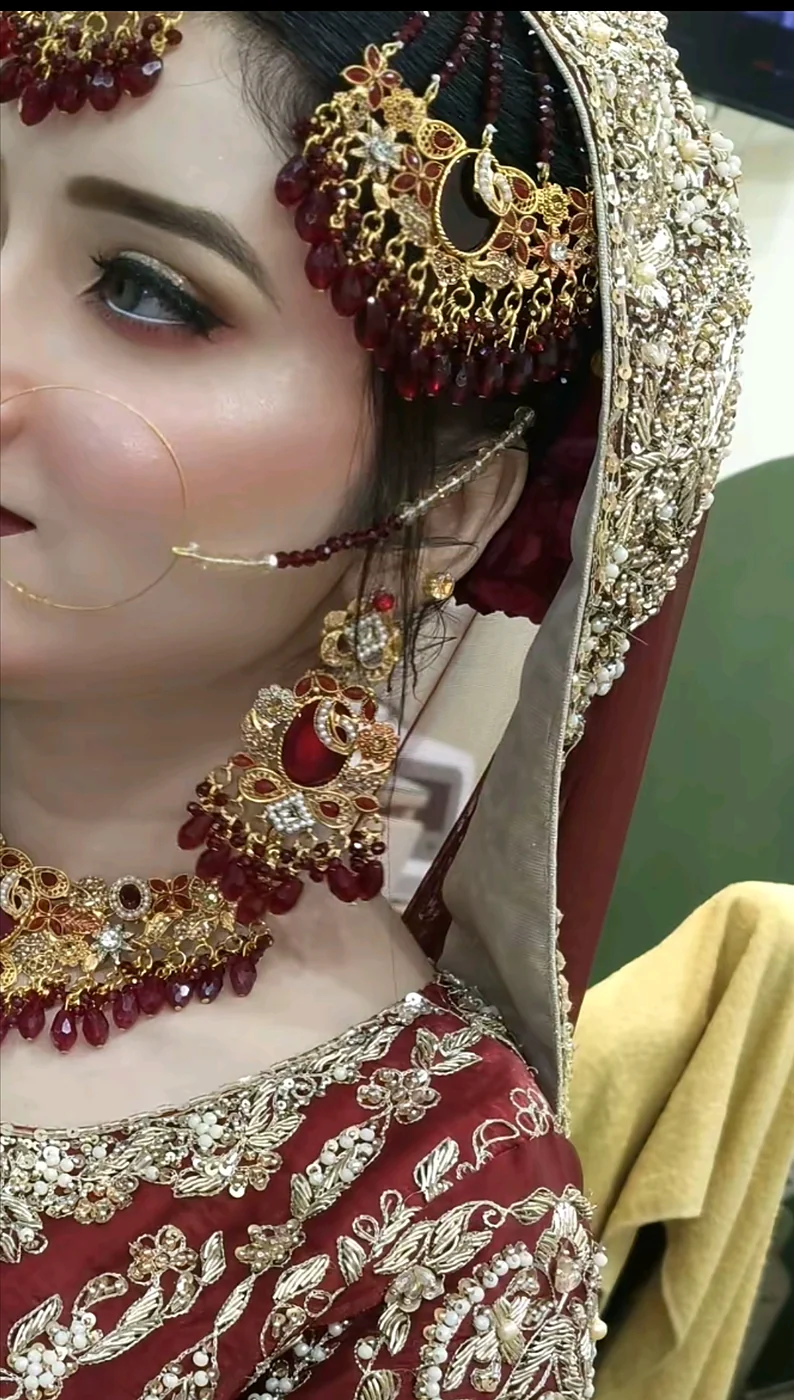 Close-up of bridal makeup with gold jewellery at Glow Beauty Salon Kasur